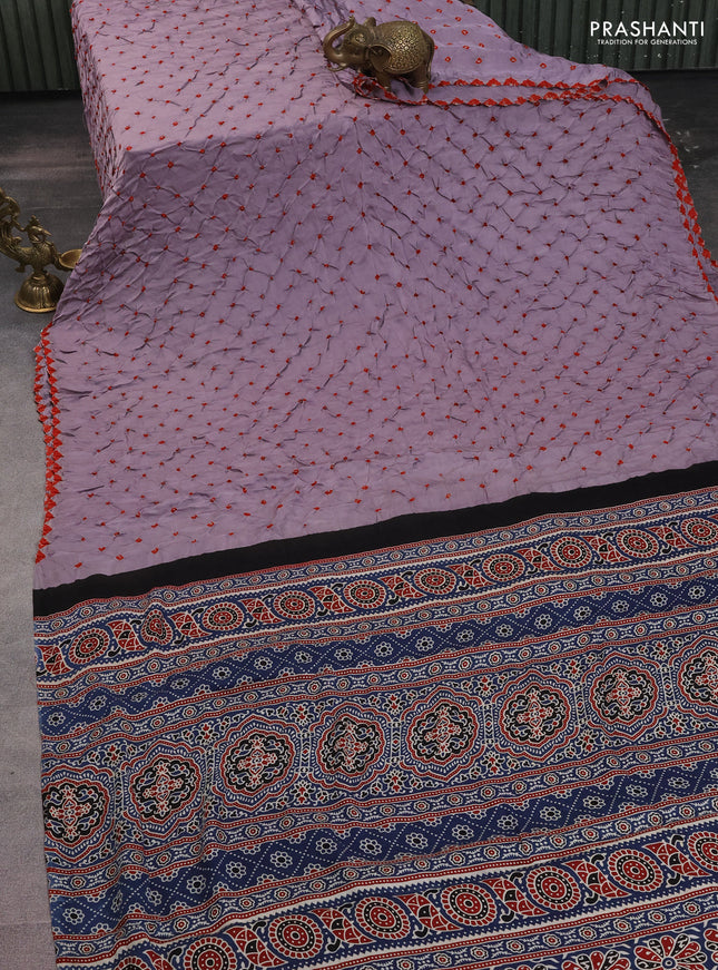Modal silk saree lavender and peacock blue with allover bandhani butta prints and ajrakh printed pallu & Blouse