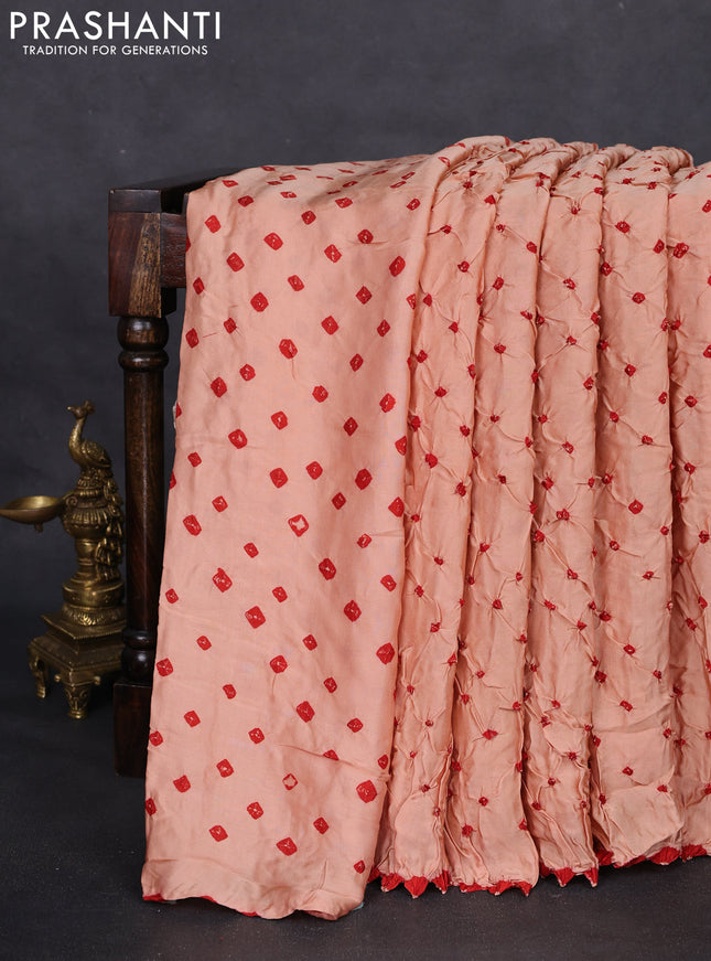 Modal silk saree peach orange and black with allover bandhani butta prints and ajrakh printed pallu & Blouse