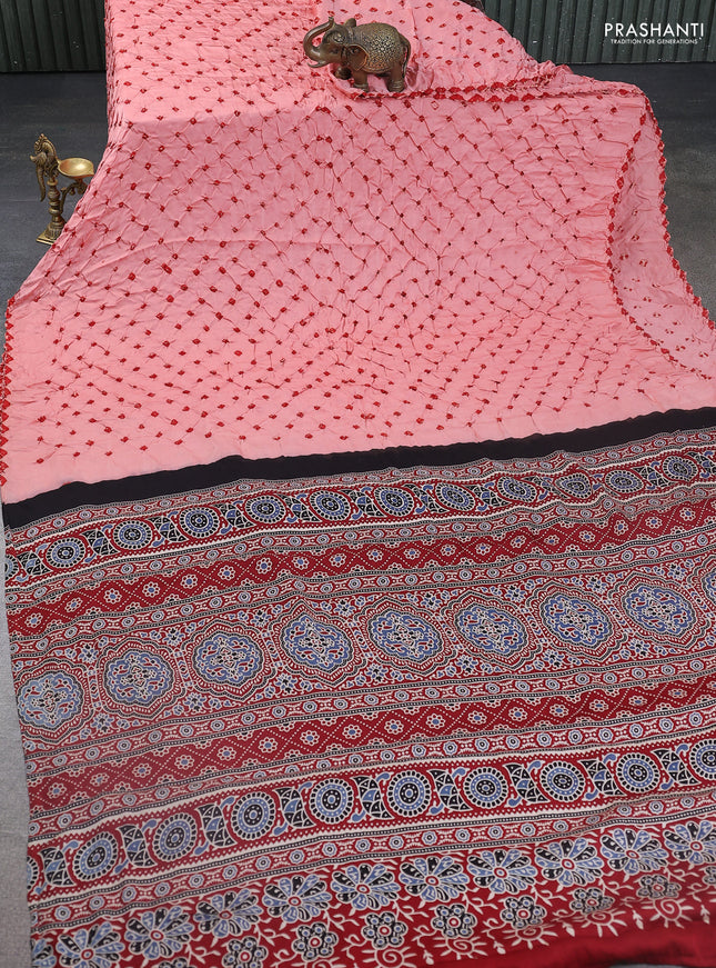 Modal silk saree peach orange and maroon with allover bandhani butta prints and ajrakh printed pallu & Blouse
