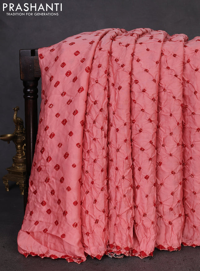 Modal silk saree peach shade and maroon with allover bandhani butta prints and ajrakh printed pallu & Blouse