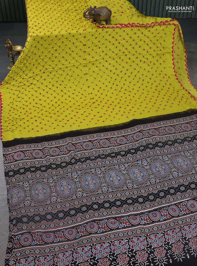 Modal silk saree lime yellow and black with allover bandhani butta prints and ajrakh printed pallu & Blouse