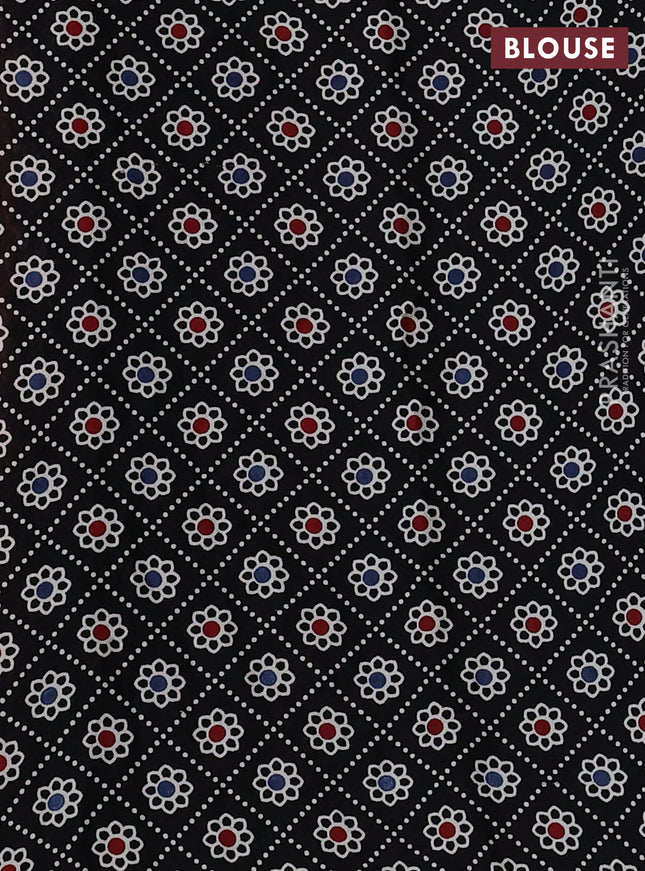 Modal silk saree peach orange and black with allover bandhani butta prints and ajrakh printed pallu & Blouse