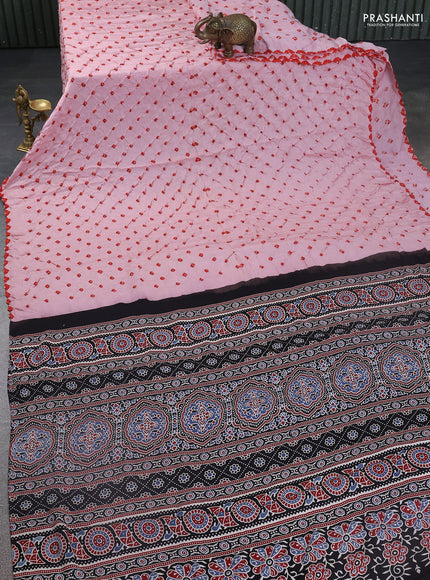 Modal silk saree peach pink and black with allover bandhani butta prints and ajrakh printed pallu & Blouse