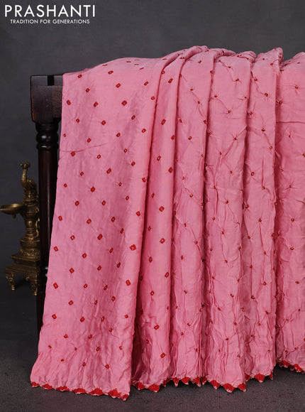 Modal silk saree peach pink and black with allover bandhani butta prints and ajrakh printed pallu & Blouse