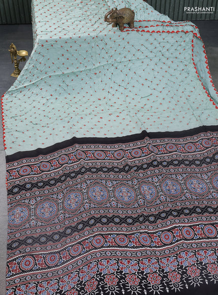 Modal silk saree pastel green and black with allover bandhani butta prints and ajrakh printed pallu & Blouse