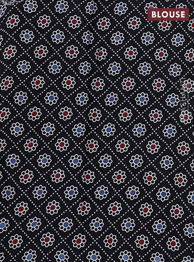 Modal silk saree pastel green and black with allover bandhani butta prints and ajrakh printed pallu & Blouse