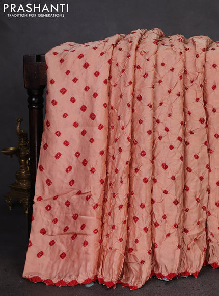 Modal silk saree peach shade and peacock blue with allover bandhani butta prints and ajrakh printed pallu & Blouse