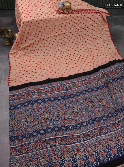 Modal silk saree peach shade and peacock blue with allover bandhani butta prints and ajrakh printed pallu & Blouse