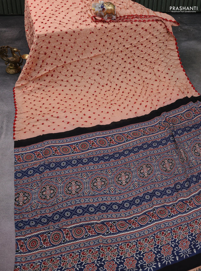 Modal silk saree peach shade and peacock blue with allover bandhani butta prints and ajrakh printed pallu & Blouse