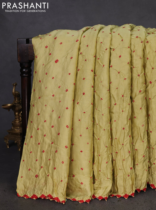 Modal silk saree pista green and black with allover bandhani butta prints and ajrakh printed pallu & Blouse