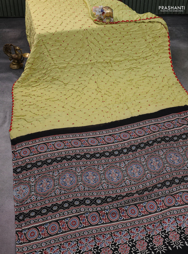Modal silk saree pista green and black with allover bandhani butta prints and ajrakh printed pallu & Blouse