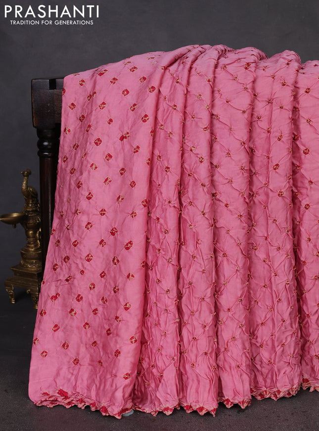 Modal silk saree peach pink and black with allover bandhani butta prints and ajrakh printed pallu & Blouse