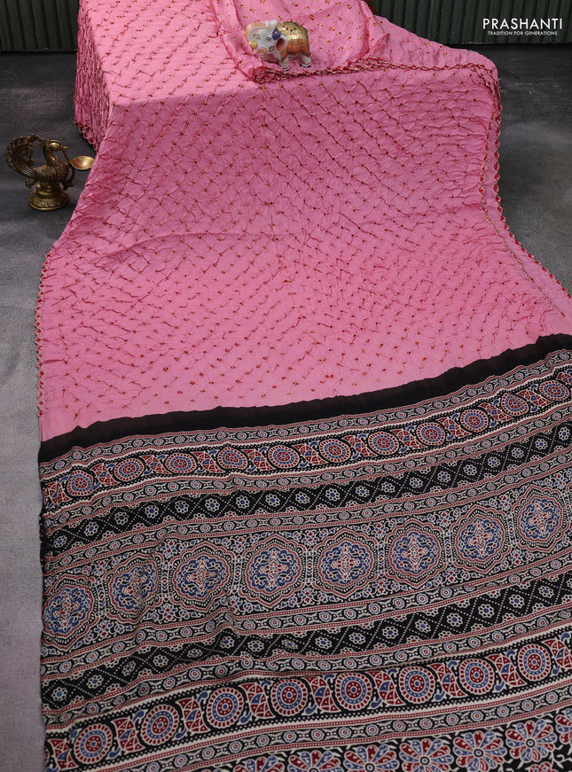 Modal silk saree peach pink and black with allover bandhani butta prints and ajrakh printed pallu & Blouse