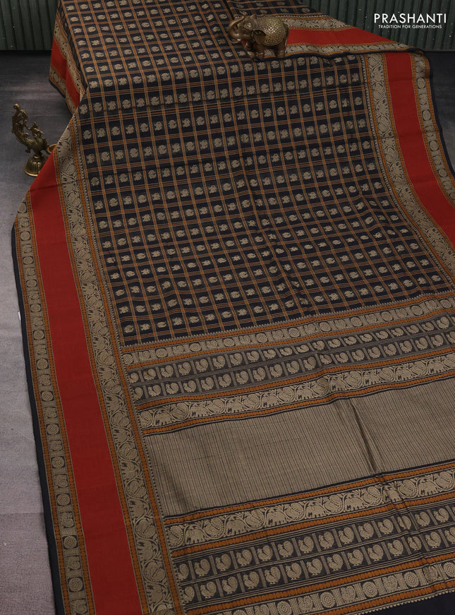 Kanchi cotton saree black and rust shade with allover thread checks & buttas and long rettapet thread woven border