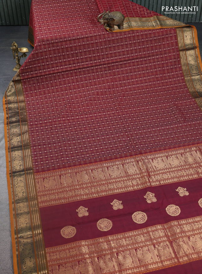 Kanchi cotton saree maroon and dark mustard with allover thread checked pattern & buttas and zari woven border