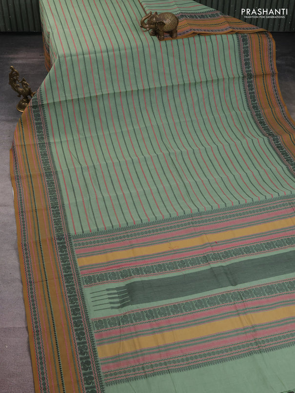 Kanchi cotton saree pastel green and dark mustard with allover thread woven stripes pattern and thread woven border