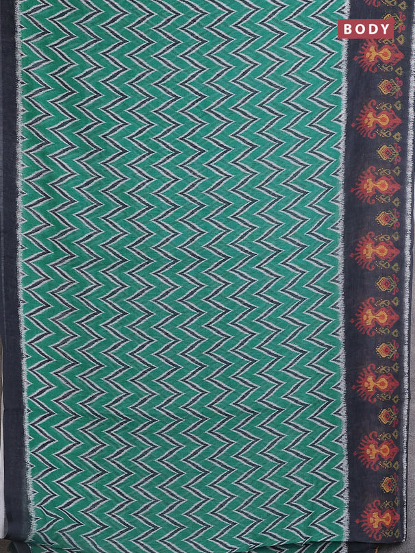 Semi linen saree teal green and elephant grey with allover zig zag ikat prints and long printed border
