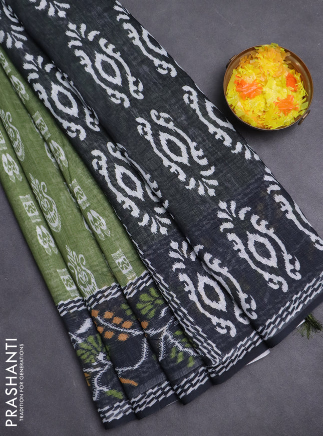 Semi linen saree green and black with allover ikat butta prints and long printed border