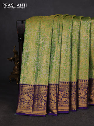Kanchipuram tissue silk saree light green and blue with allover zari woven brocade weaves and zari woven border