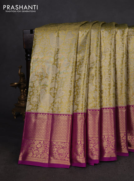 Kanchipuram silk saree light green and purple with allover zari woven brocade weaves and zari woven border