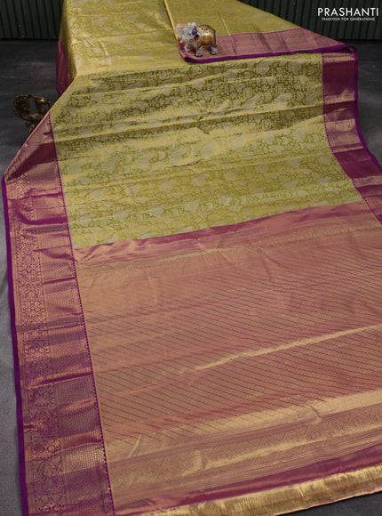 Kanchipuram silk saree light green and purple with allover zari woven brocade weaves and zari woven border