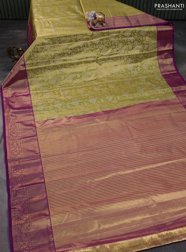 Kanchipuram silk saree light green and purple with allover zari woven brocade weaves and zari woven border