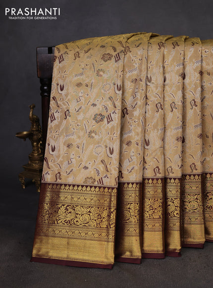 Kanchipuram tissue silk saree sandal and deep maroon with allover zari woven brocade weaves and zari woven border