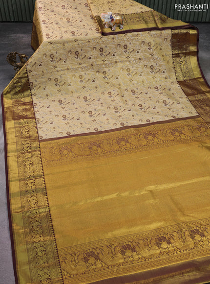 Kanchipuram tissue silk saree sandal and deep maroon with allover zari woven brocade weaves and zari woven border