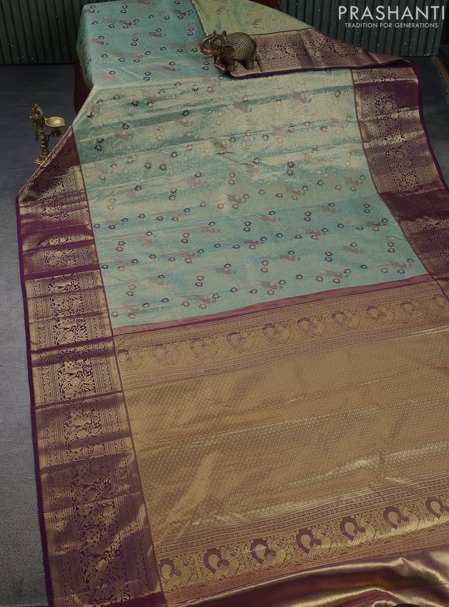 Kanchipuram tissue silk saree teal and wine shade with allover zari woven brocade weaves and zari woven border