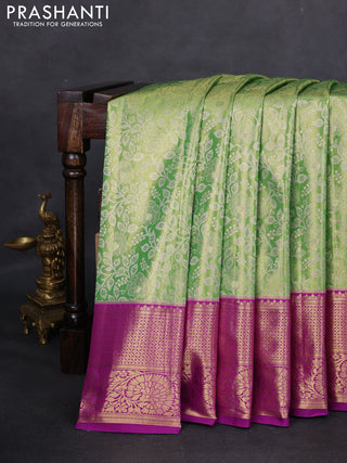 Kanchipuram tissue silk saree light green and purple with allover zari woven brocade weaves and zari woven border