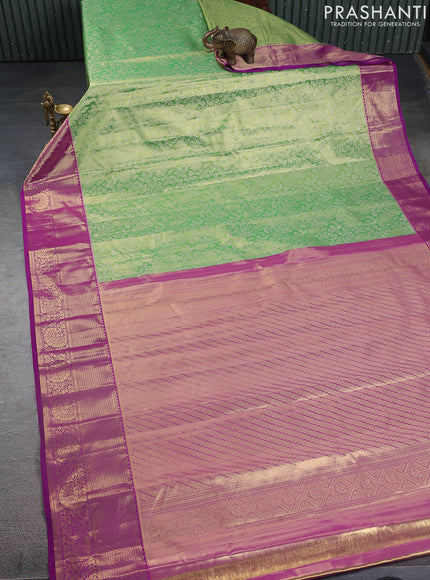 Kanchipuram tissue silk saree light green and purple with allover zari woven brocade weaves and zari woven border