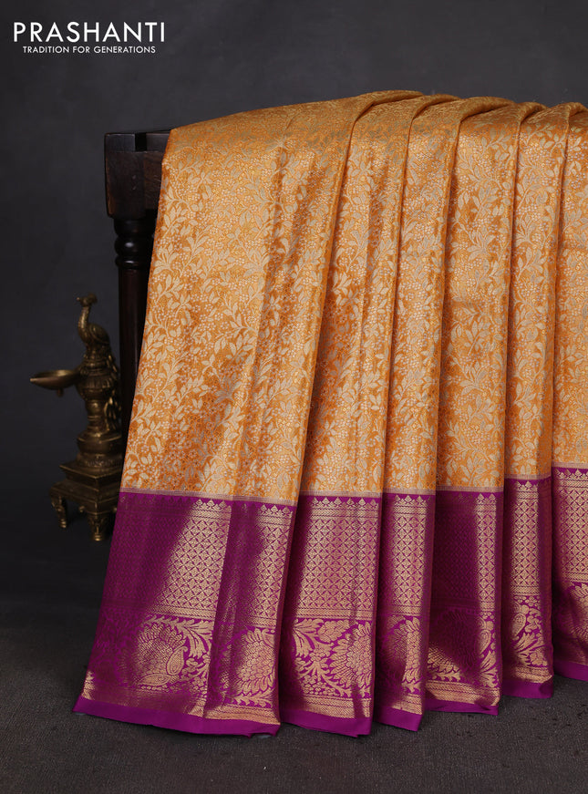 Kanchipuram tissue silk saree orange and purple with allover zari woven brocade weaves and zari woven border