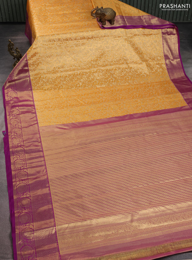 Kanchipuram tissue silk saree orange and purple with allover zari woven brocade weaves and zari woven border