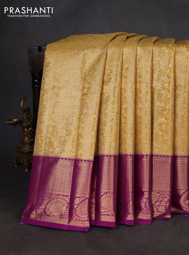 Kanchipuram tissue silk saree yellow and purple with allover zari woven brocade weaves and zari woven border