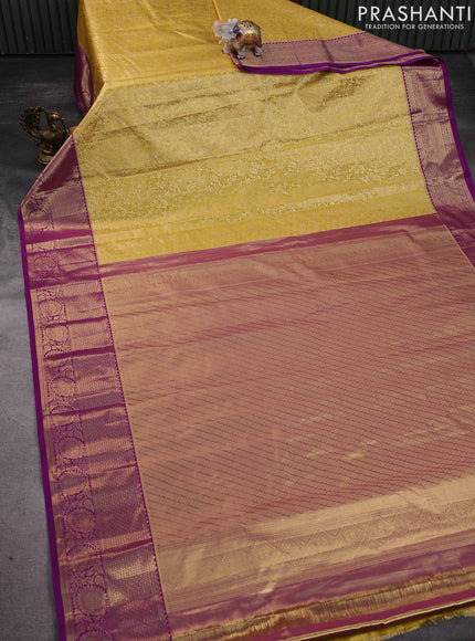 Kanchipuram tissue silk saree yellow and purple with allover zari woven brocade weaves and zari woven border