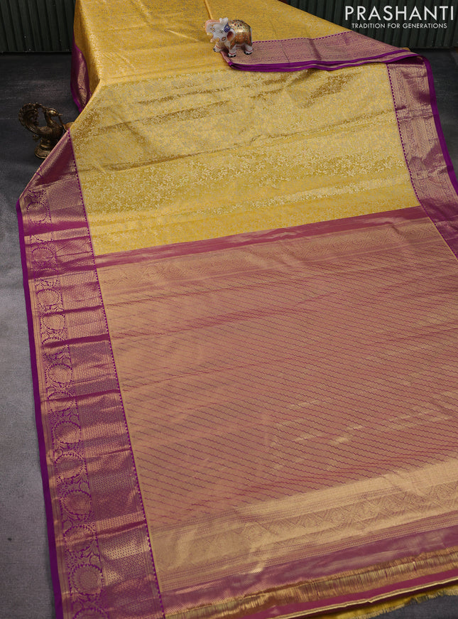 Kanchipuram tissue silk saree yellow and purple with allover zari woven brocade weaves and zari woven border