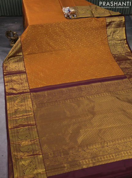 Kanchipuram silk saree rustic orange and deep maroon with allover zari woven brocade weaves and zari woven border