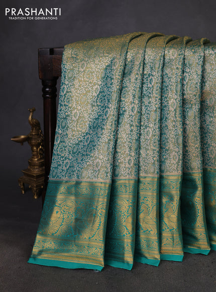Kanchipuram tissue silk saree teal green with allover zari woven brocade weaves and zari woven border