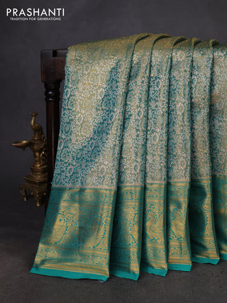 Kanchipuram tissue silk saree teal green with allover zari woven brocade weaves and zari woven border