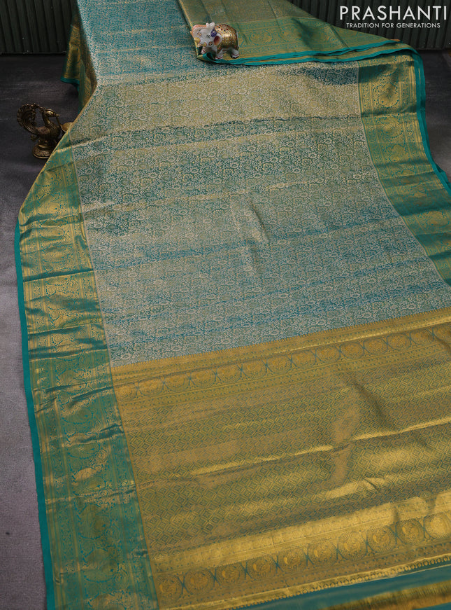 Kanchipuram tissue silk saree teal green with allover zari woven brocade weaves and zari woven border