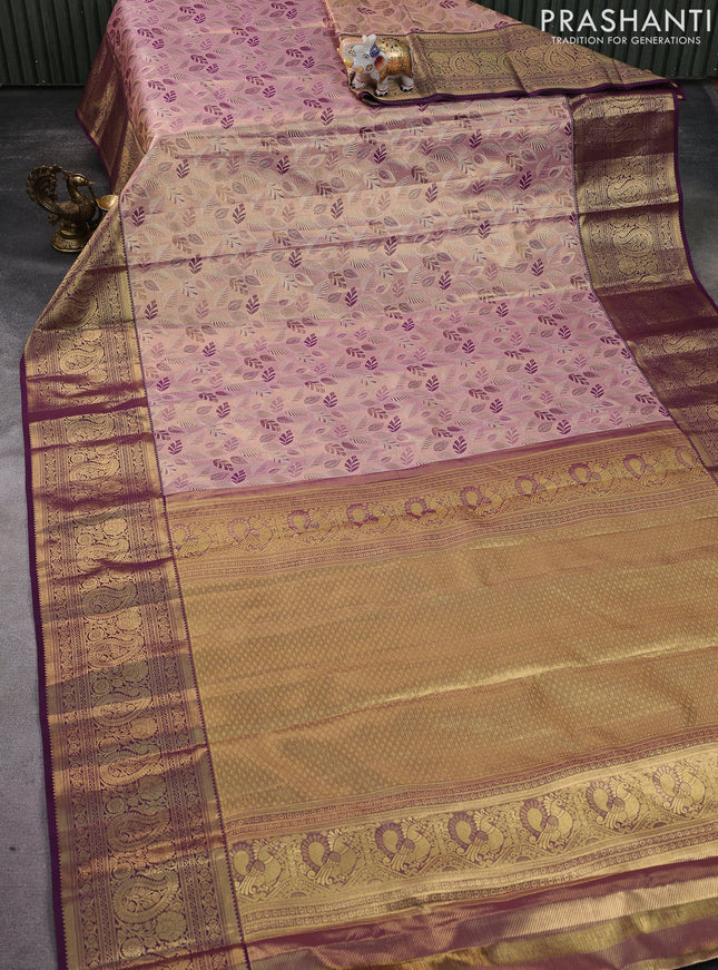Kanchipuram tissue silk saree pastel pink and purple with allover zari woven brocade weaves and zari woven border