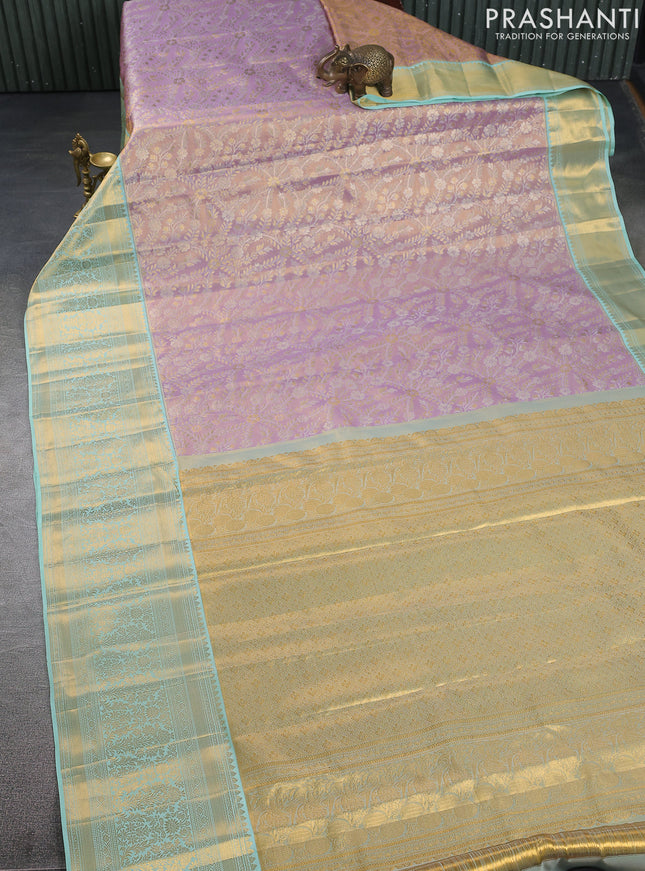Kanchipuram tissue silk saree lavender and teal shade with allover zari woven brocade weaves and zari woven border