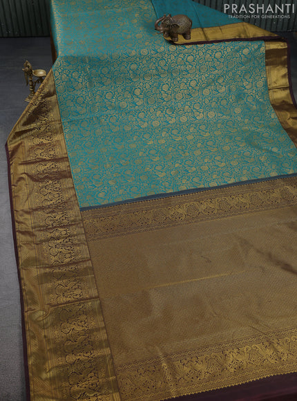 Kanchipuram silk saree teal green and coffee brown with allover zari woven brocade weaves and long zari woven border