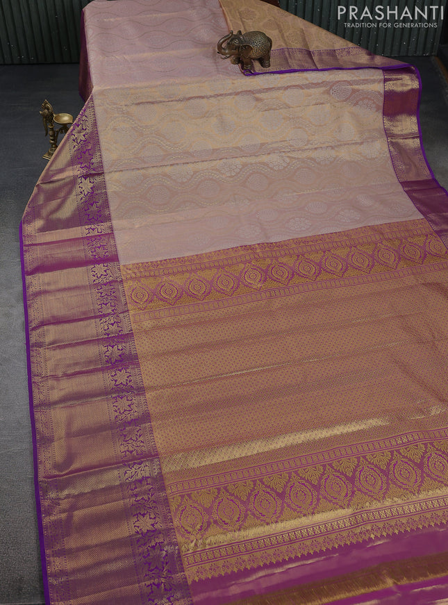 Kanchipuram tissue silk saree pastel pink and purple with allover zari woven brocade weaves and long zari woven border