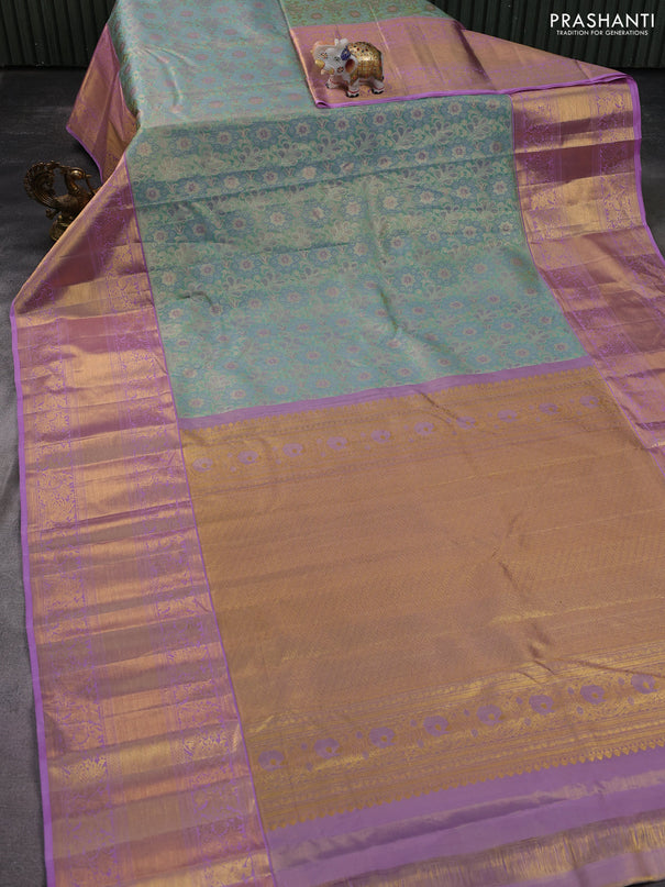 Kanchipuram tissue silk saree teal green and lavender with allover zari woven brocade weaves and long zari woven border