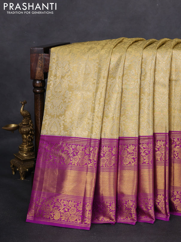 Kanchipuram tissue silk saree sandal and purple with allover zari woven brocade weaves and long zari woven border