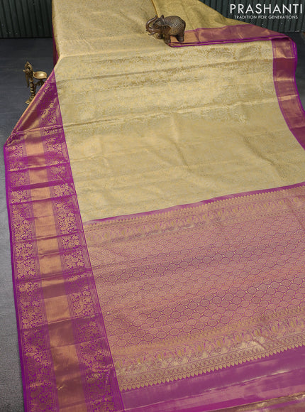 Kanchipuram tissue silk saree sandal and purple with allover zari woven brocade weaves and long zari woven border