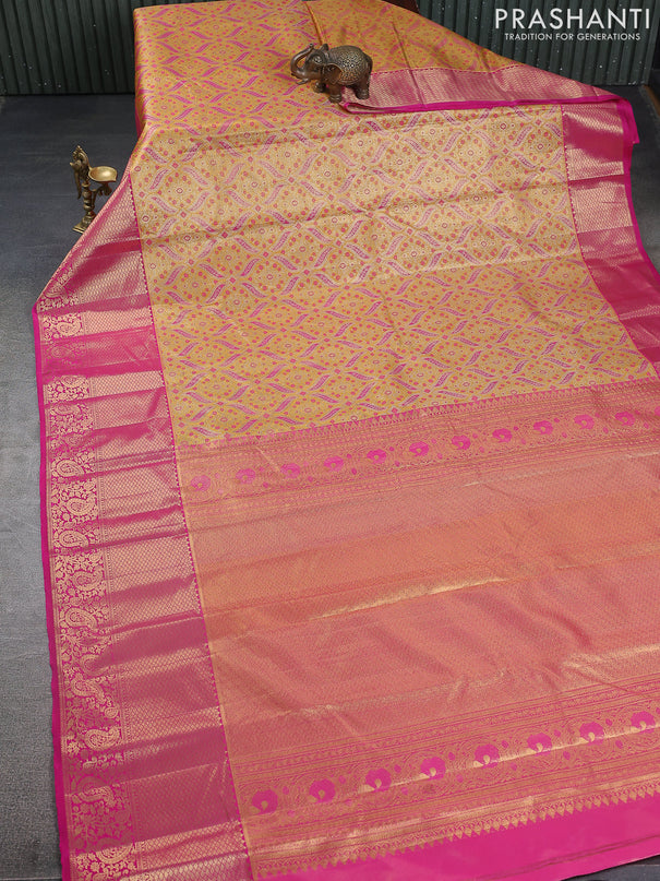 Kanchipuram tissue silk saree mustard yellow and pink with allover zari woven brocade weaves and zari woven border