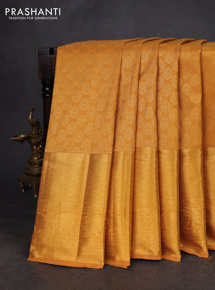 Kanchipuram silk saree mustard yellow with allover zari woven brocade weaves and long zari woven border