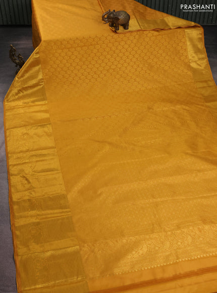 Kanchipuram silk saree mustard yellow with allover zari woven brocade weaves and long zari woven border